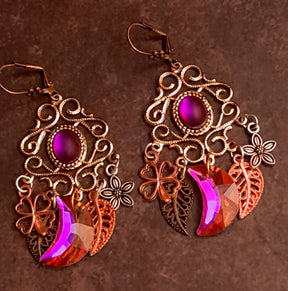 Fuchsia Swarovski crescent chandelier earrings with flowers, four leaf clovers, and layered leaves in Victorian style and vintage style by Rachel Flam Design