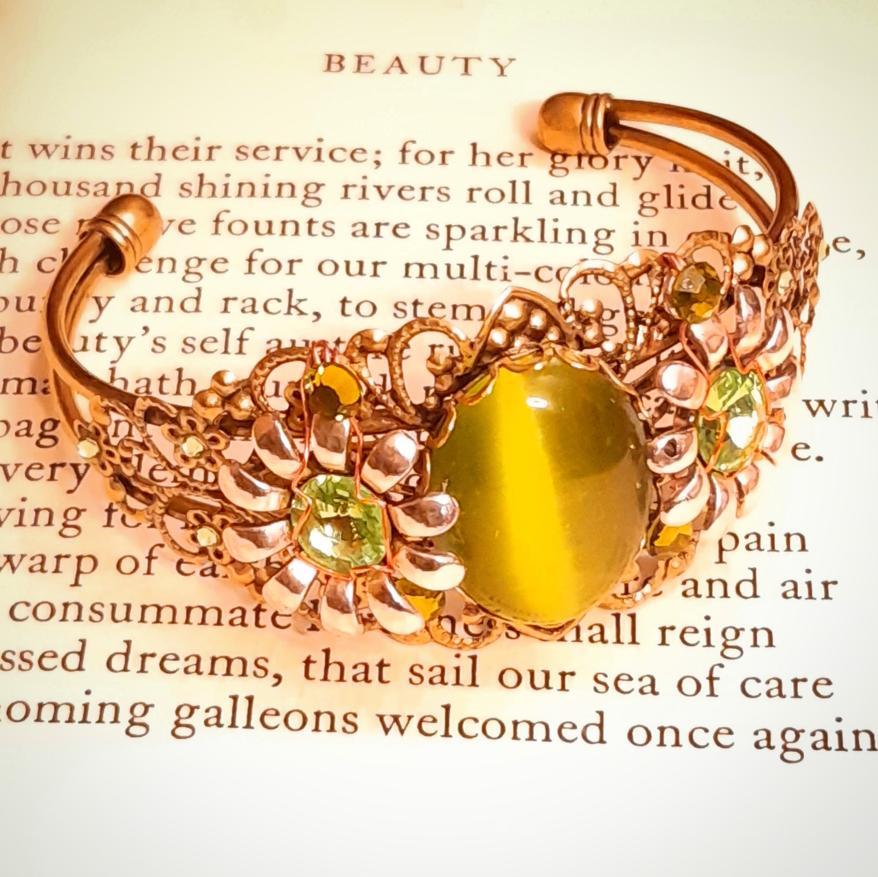 Green cat’s-eye centerpiece bracelet with dimensional flowers, ornate filigree, and sparkling Swarovski crystals, Victorian style vintage style handmade fantasy jewelry