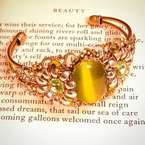 Green cat’s-eye centerpiece bracelet with dimensional flowers, ornate filigree, and sparkling Swarovski crystals, Victorian style vintage style handmade fantasy jewelry