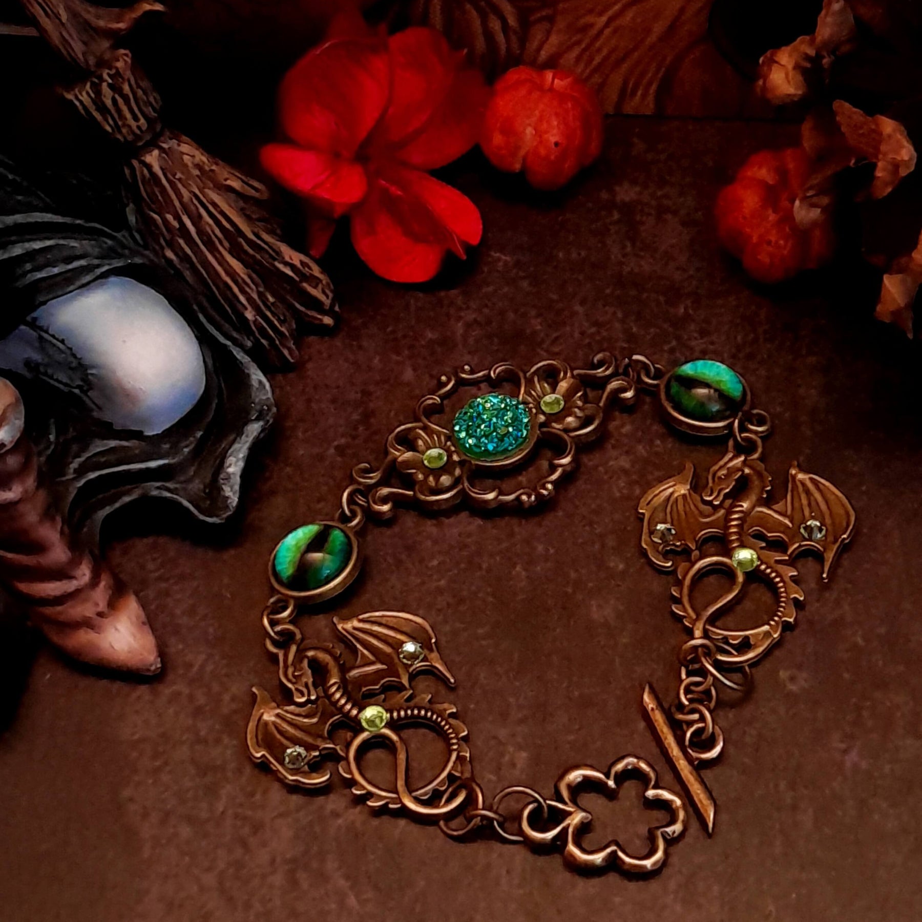 green druzy crystal bracelet with green dragon eyes and brass dragons swarovski green crystals and flower clasp