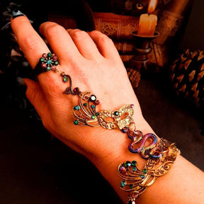 slave bracelet hand chain with adjustable flower ring and masks. colcorful flowers and vines a serpent snake and swarovski crystals