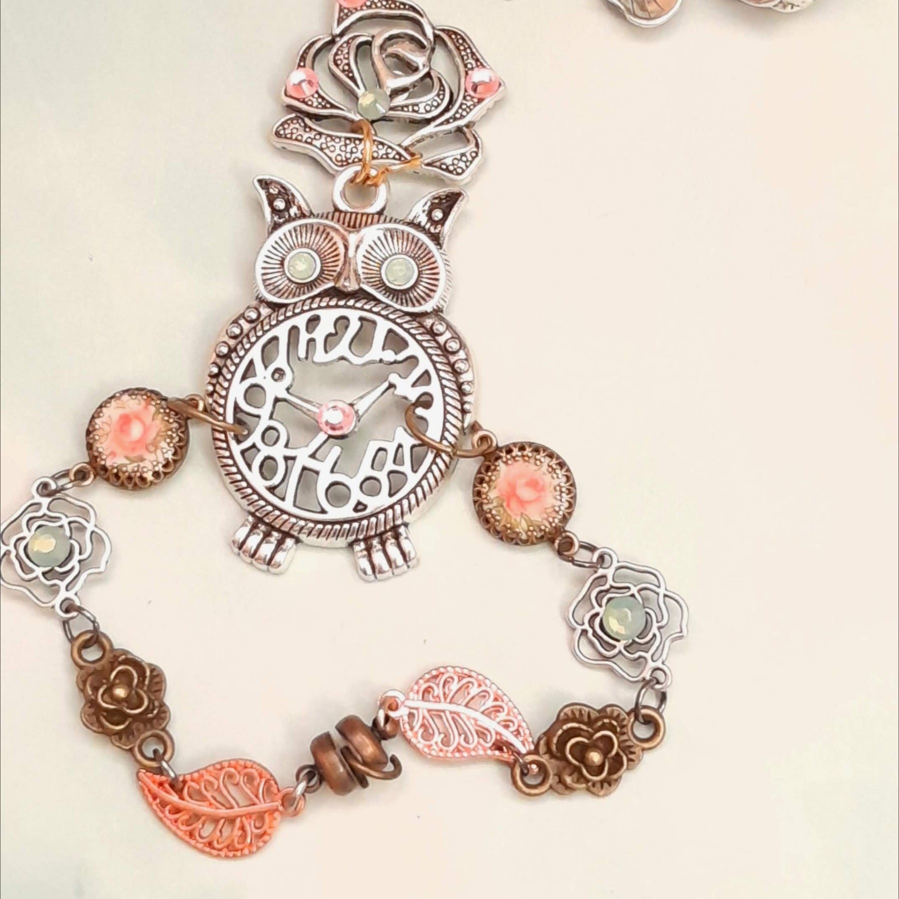 Magical fantasy owl hand chain showing complete piece from rose ring to owl centerpiece with Swarovski crystals Victorian style vintage style