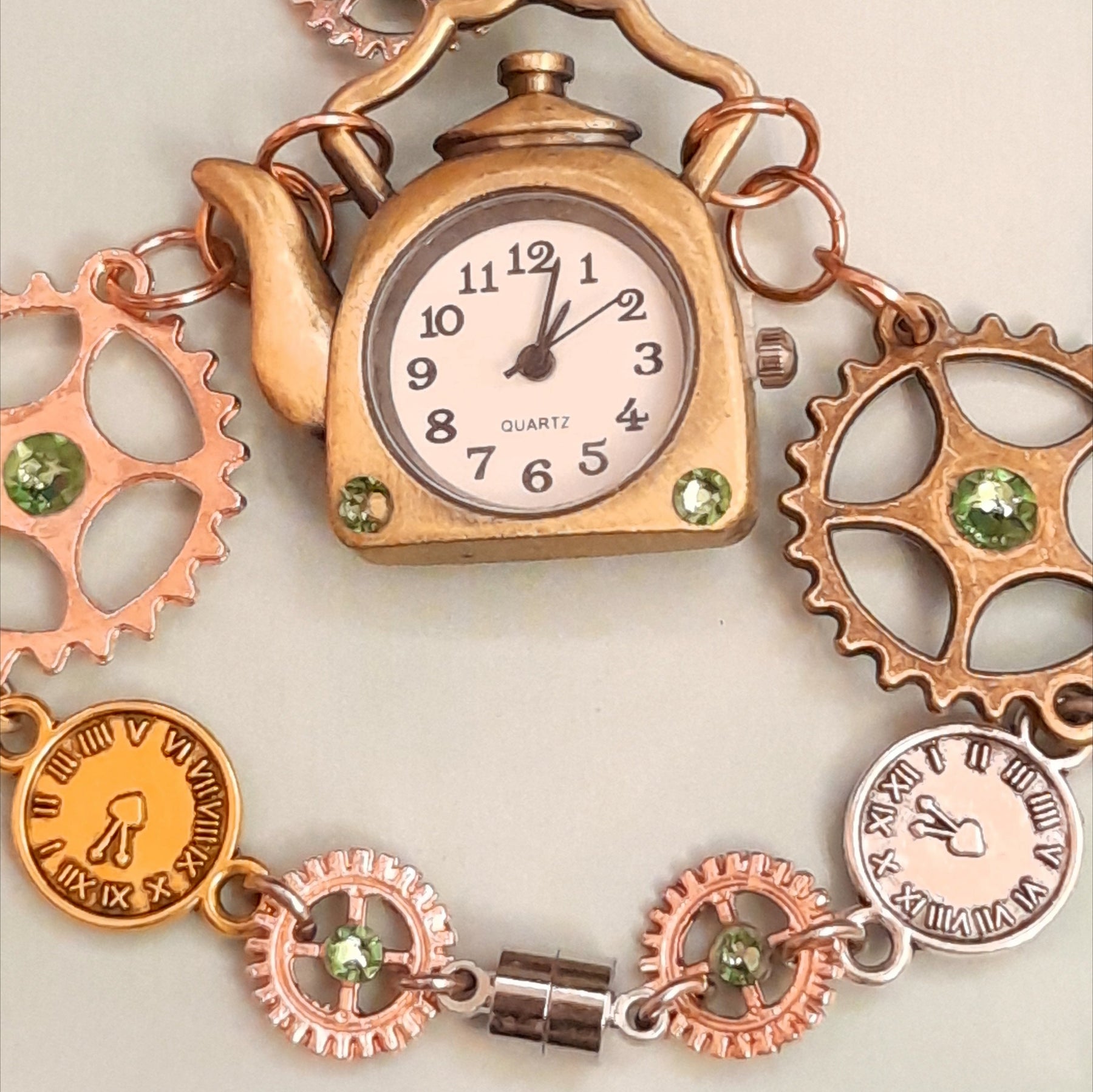Magical fantasy hand chain teapot watch Alice in Wonderland steampunk gears cogs with green Swarovski crystals bracelet detail, Victorian style vintage style