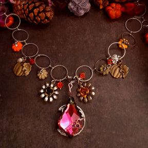Handmade Halloween crystal pendant and flower necklace with a baroque Volcano Swarovski crystal, owl crescent moon reverse, pumpkins, and nature details, Victorian style vintage style magical fantasy jewelry by Rachel Flam Design