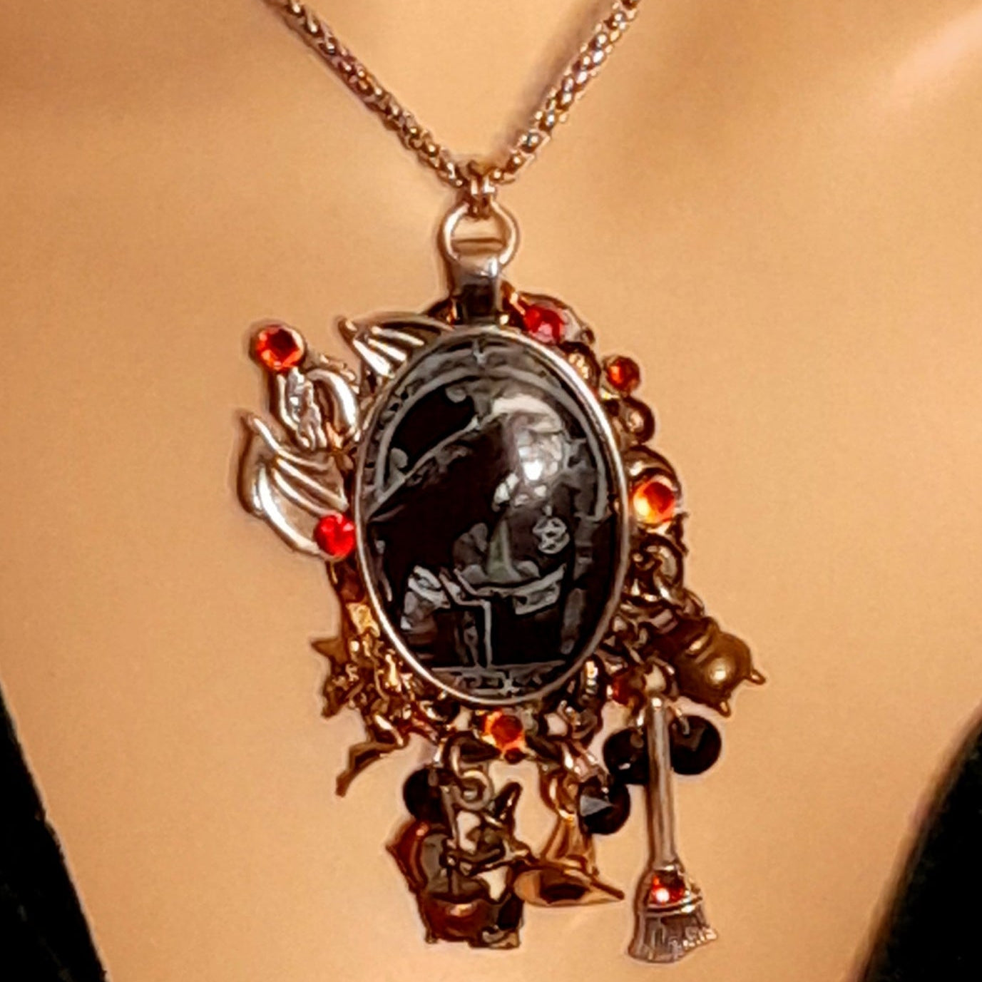 Handmade witchy black crow fairy and dragon necklace charm detail with crow, fairy, dragon, witch and cauldron motifs, Swarovski crystals, Victorian style vintage style magical fantasy jewelry