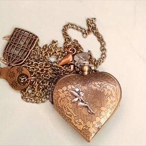 Handmade magical fantasy heart pocket watch necklace back view fairy charm on floral engraved antiqued brass, birdcage and key charms, Victorian style vintage style