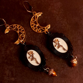 Back detail of crow and moon dangle earrings showing hidden fairy cameos and acorn drops, Victorian style vintage style nature Halloween jewelry, Rachel Flam Design