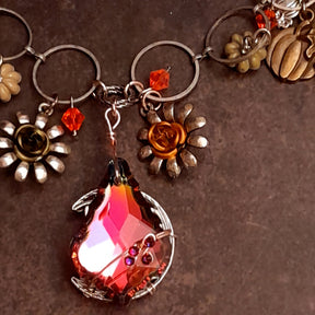 Handmade Halloween necklace with Hyacinth Swarovski crystals nestled between pumpkins and flower details, Victorian style vintage style nature jewelry
