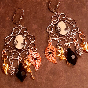 Romantic Victorian style chandelier earrings with old world cameo portraits, ornate scrollwork, jet black Swarovski crystals, leaves, pinecones, and nature inspired details, vintage style jewelry by Rachel Flam Design