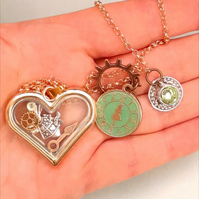 Rachel Flam Design Alice in Wonderland Locket Necklace White Rabbit Gears Clock Hands Alice Green Clock Charm Teacup with Swarovski Peridot crystal inside and bottom 