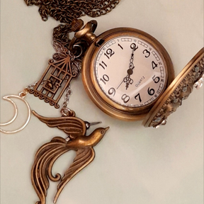 Magical fantasy pocket watch necklace face with lovebirds, birdcage, dragonfly, butterfly and fairy charms, Swarovski crystals, Victorian style, vintage style, Rachel Flam Design