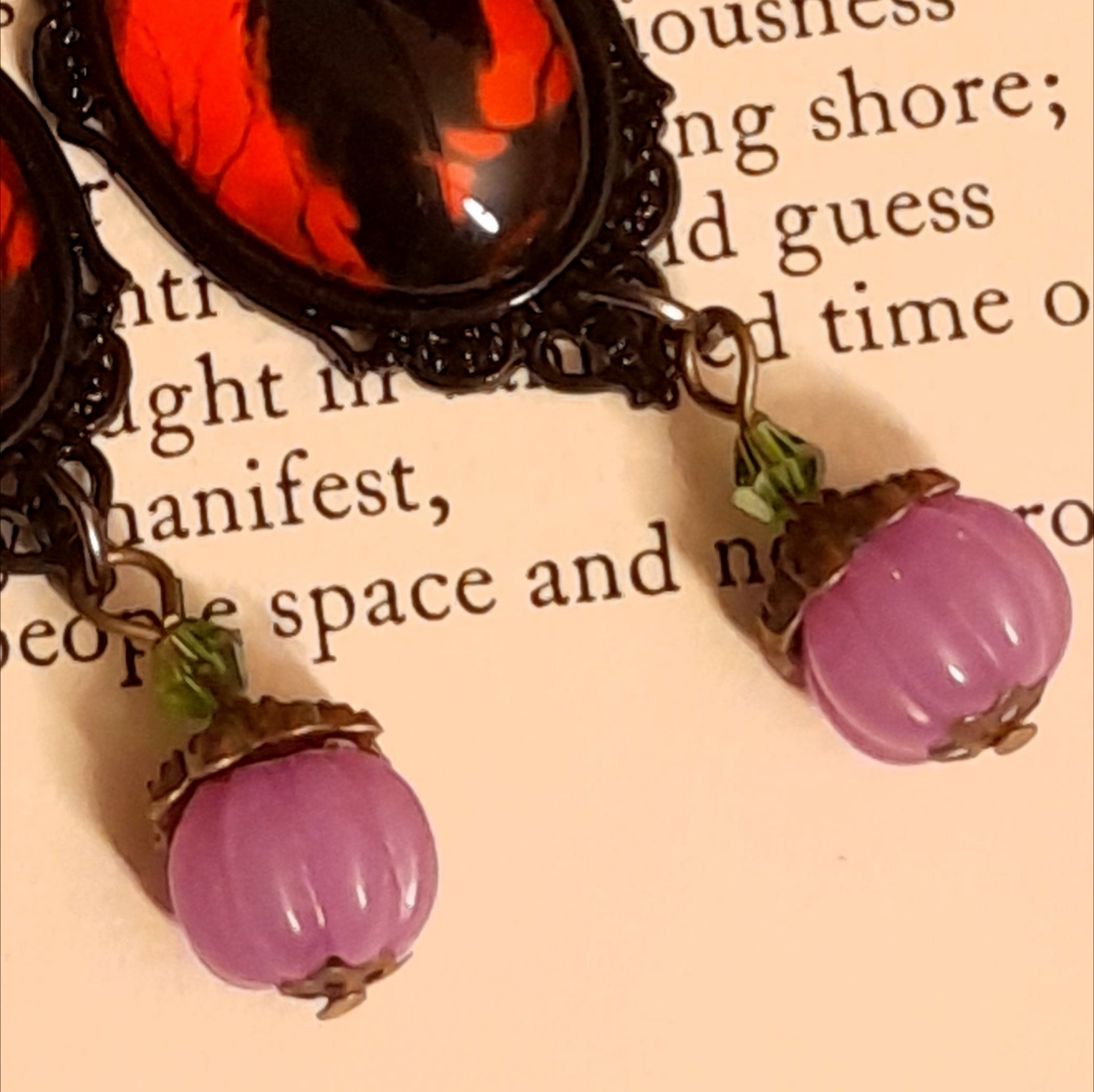 Magical fantasy crow earrings with crescent moons, stars, vivid red cabochons, smoky purple crystals, pumpkin charms, and private fairy details on the reverse, Victorian style and vintage style jewelry by Rachel Flam Design