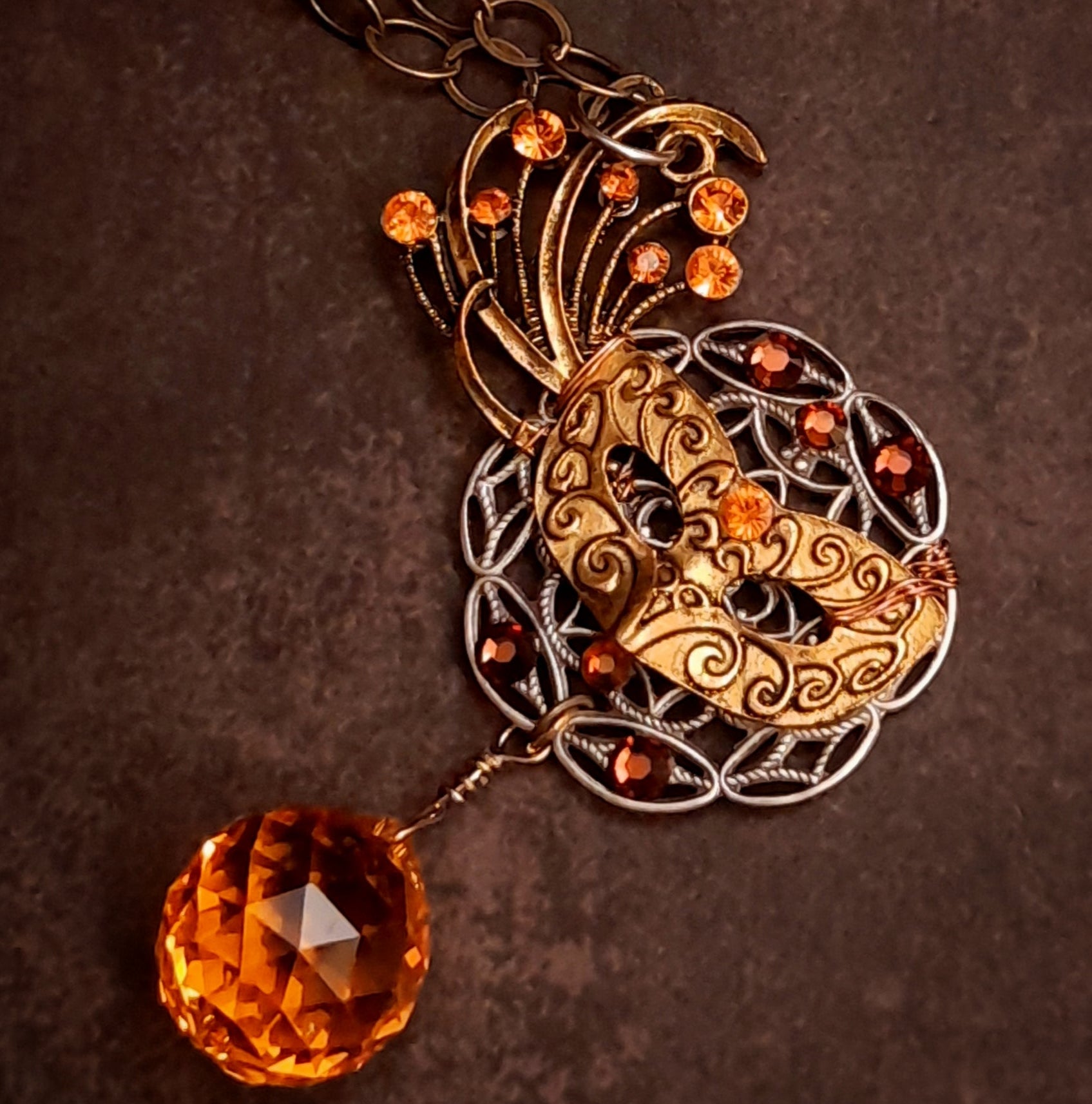 Magical Masquerade necklace with theatrical filigree, glowing orange Swarovski crystals, and a statement Citrine crystal ball, one of a kind fantasy Halloween jewelry with Victorian style vintage style charm by Rachel Flam Design