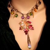 Handmade magical Halloween fantasy nature necklace with pumpkins, leaves, feathers, Swarovski crystals and a maple leaf in Victorian style and vintage style by Rachel Flam Design