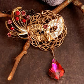 Victorian style vintage style masquerade mask necklace pendant with a red and pink Swarovski crystal feather fan and dangling crystal drop