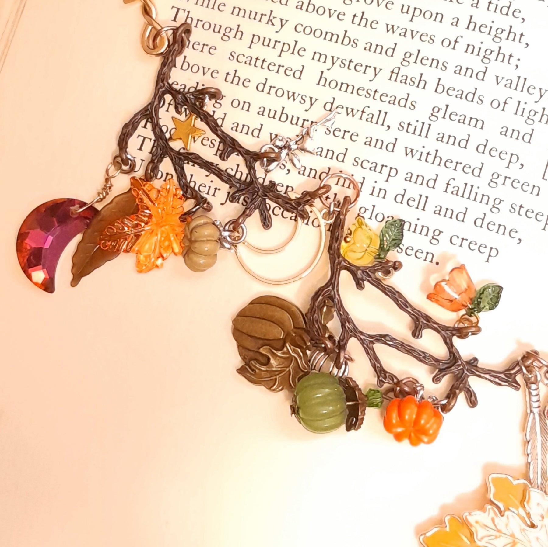 Handmade Halloween maple leaf necklace with layered green, orange, red, and yellow nature details, pumpkins, and sparkling Swarovski crystals, Victorian style vintage style magical jewelry