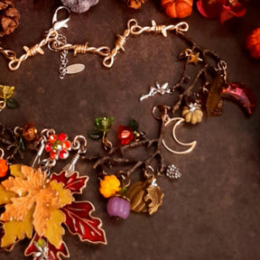 Handmade Halloween maple leaf and pumpkin necklace with layered lower details, dangling accents, and Swarovski crystal sparkle, Victorian style vintage style magical fantasy jewelry