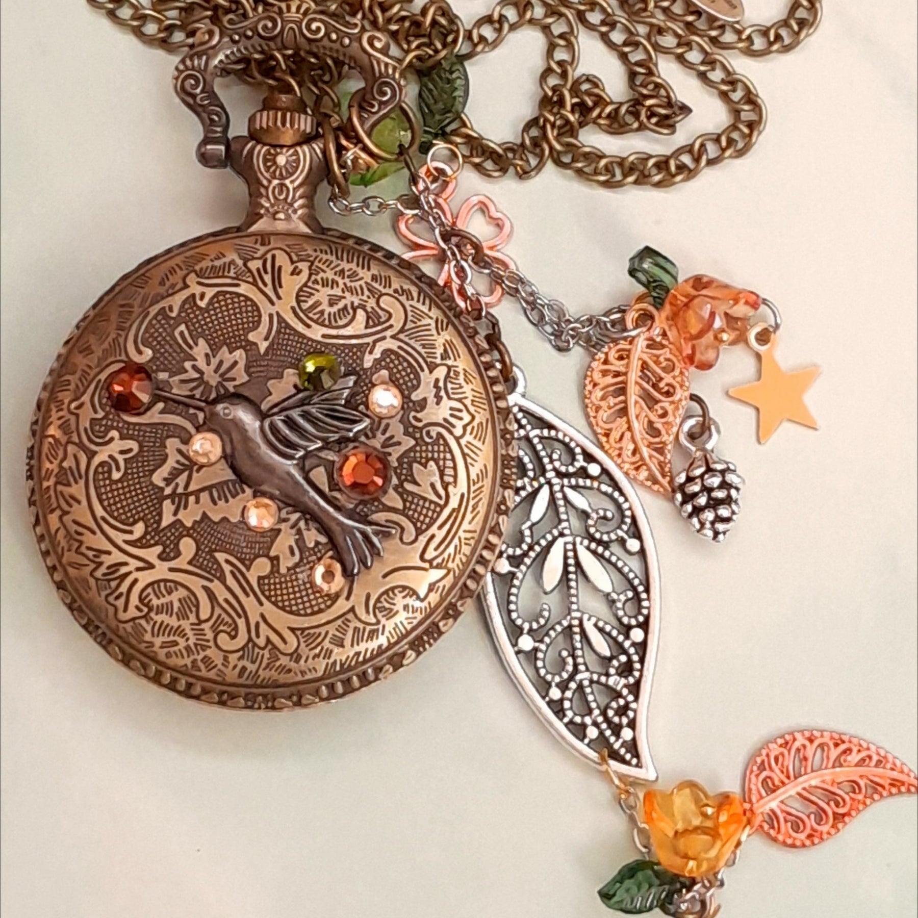 Handmade magical fantasy wolf pocket watch necklace back with hummingbird and Swarovski crystals, antiqued brass, leaf and rose charms, Victorian style vintage styled