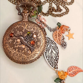 Handmade magical fantasy wolf pocket watch necklace back with hummingbird and Swarovski crystals, antiqued brass, leaf and rose charms, Victorian style vintage styled