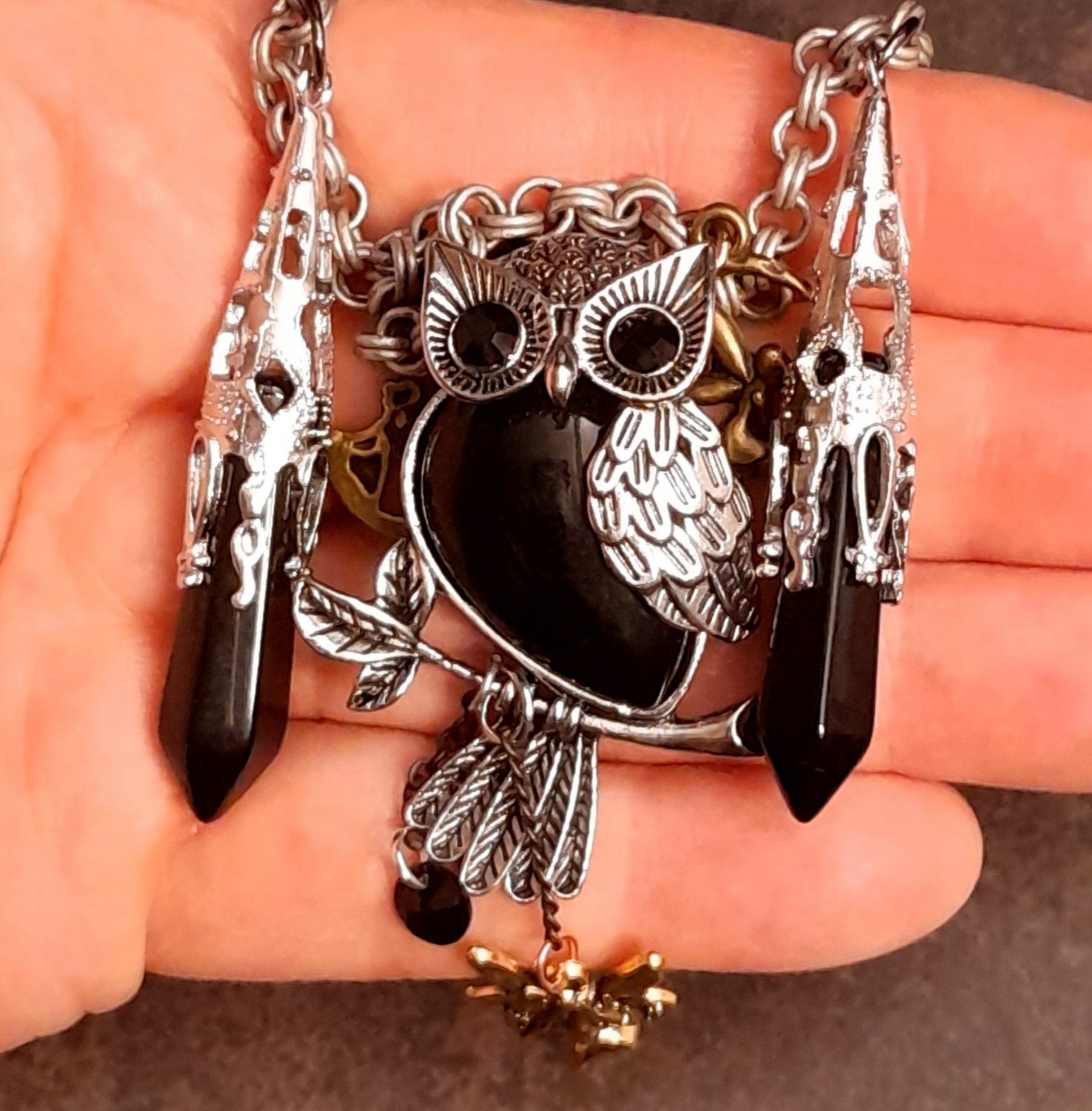 Close-up of owl pendant necklace with black Swarovski crystal drops, Victorian style and vintage style fantasy jewelry by Rachel Flam Design