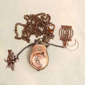 Cute owl pocket watch necklace back view showing fairy on back with chain bird cage moon charm animal jewelry Victorian style vintage style handmade Rachel Flam Design