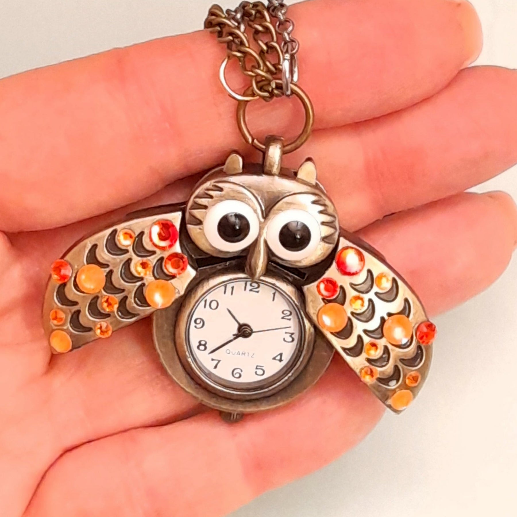 Cute owl pocket watch necklace wings open held in hand Swarovski orange crystals animal jewelry Victorian style vintage style handmade Rachel Flam Design