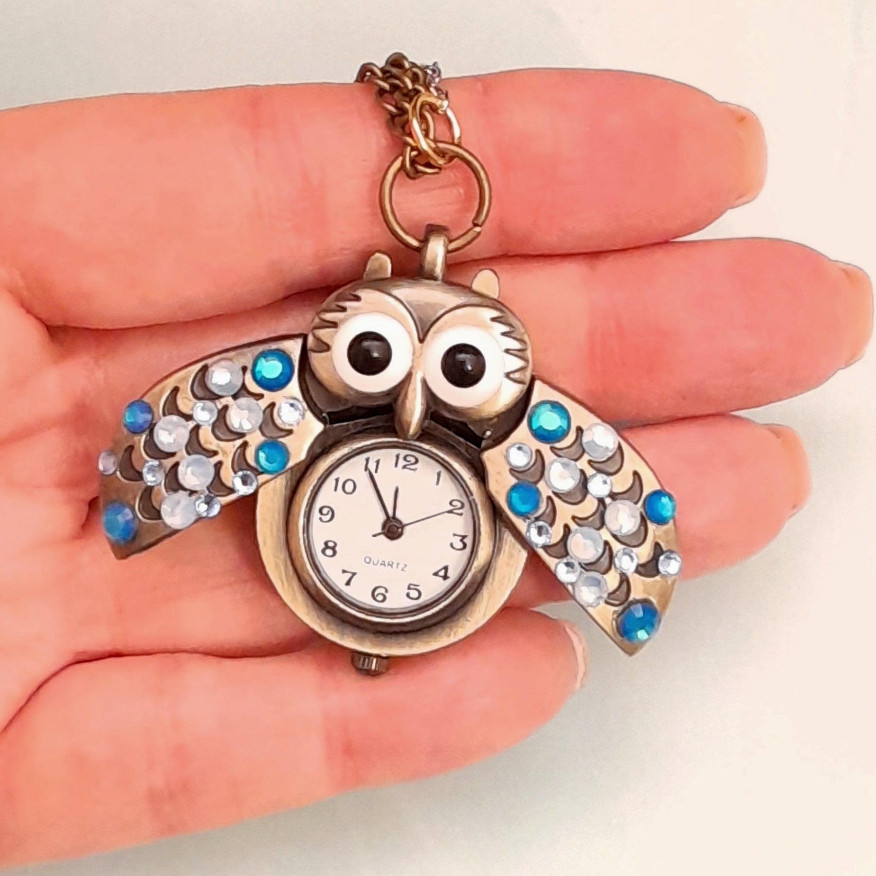 Cute owl pocket watch necklace wings open revealing working clock face Swarovski blue crystals animal jewelry Victorian style vintage style handmade Rachel Flam Design