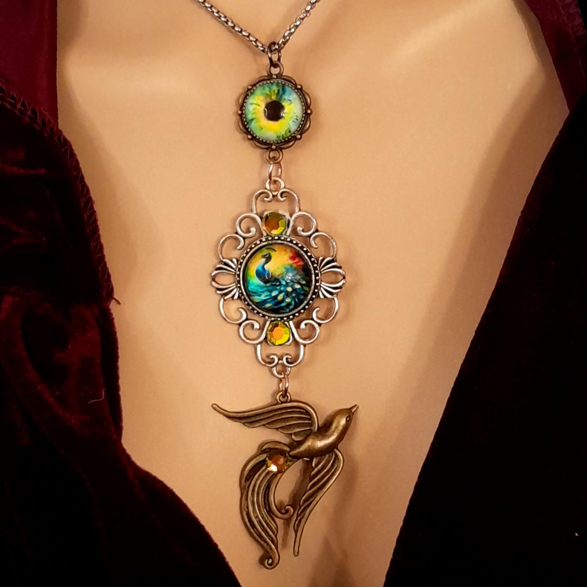 peacock cabochon peacock eye magical phoenix swarovski volcano and peridot crystals hidden fairies on the back