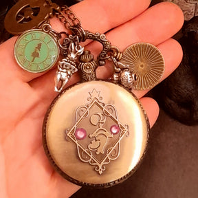 Back view of magical handmade fantasy Alice in Wonderland pocket watch necklace with world-renowned genuine Swarovski purple crystals