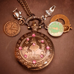 Magical fantasy handmade pocket watch necklace with Alice in Wonderland design and world-renowned genuine Swarovski purple crystals