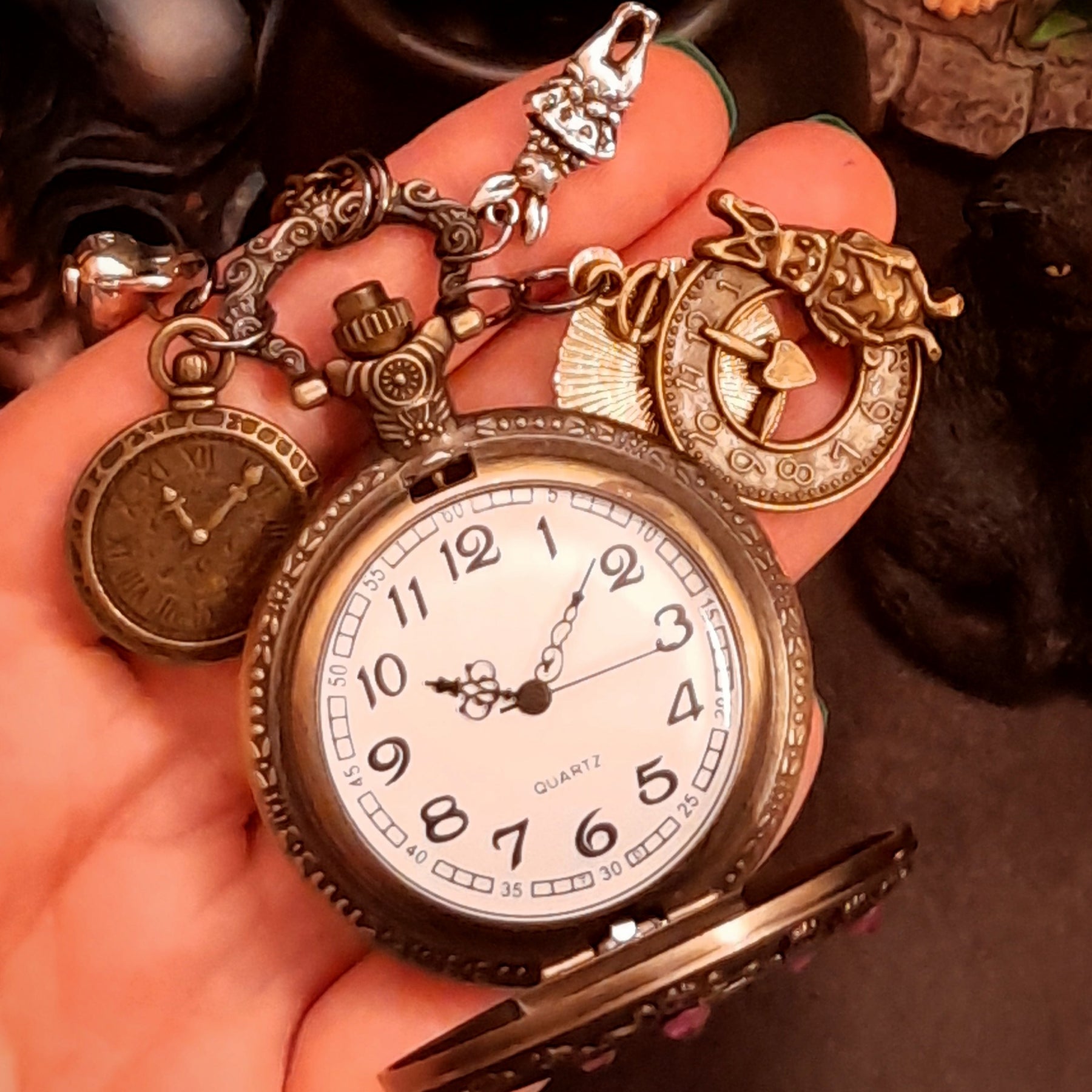Magical fantasy handmade Alice in Wonderland pocket watch necklace open showing interior detail victorian style