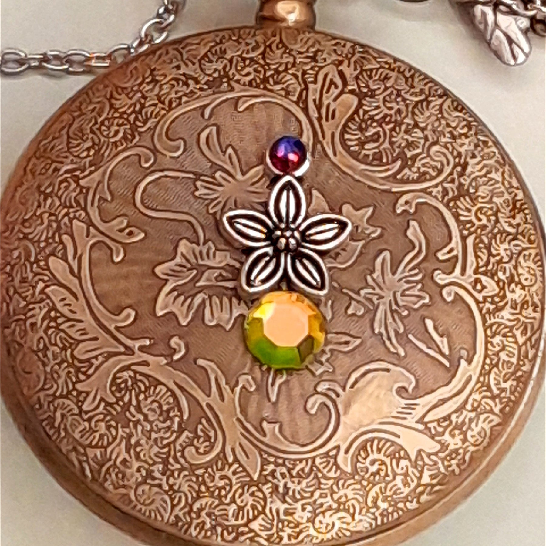 Handmade magical fantasy pocket watch necklace side view showing lovebirds, birdcage and dragonfly charms, Swarovski crystals, Victorian style, vintage style, Rachel Flam Design