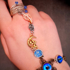 blue hand chain with faries druzy crystal dragon eye and leaves and flowers