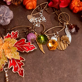 Handmade Halloween necklace featuring dimensional pumpkins, feathers, leaves and colorful Swarovski crystals in Victorian style and vintage style by Rachel Flam Design