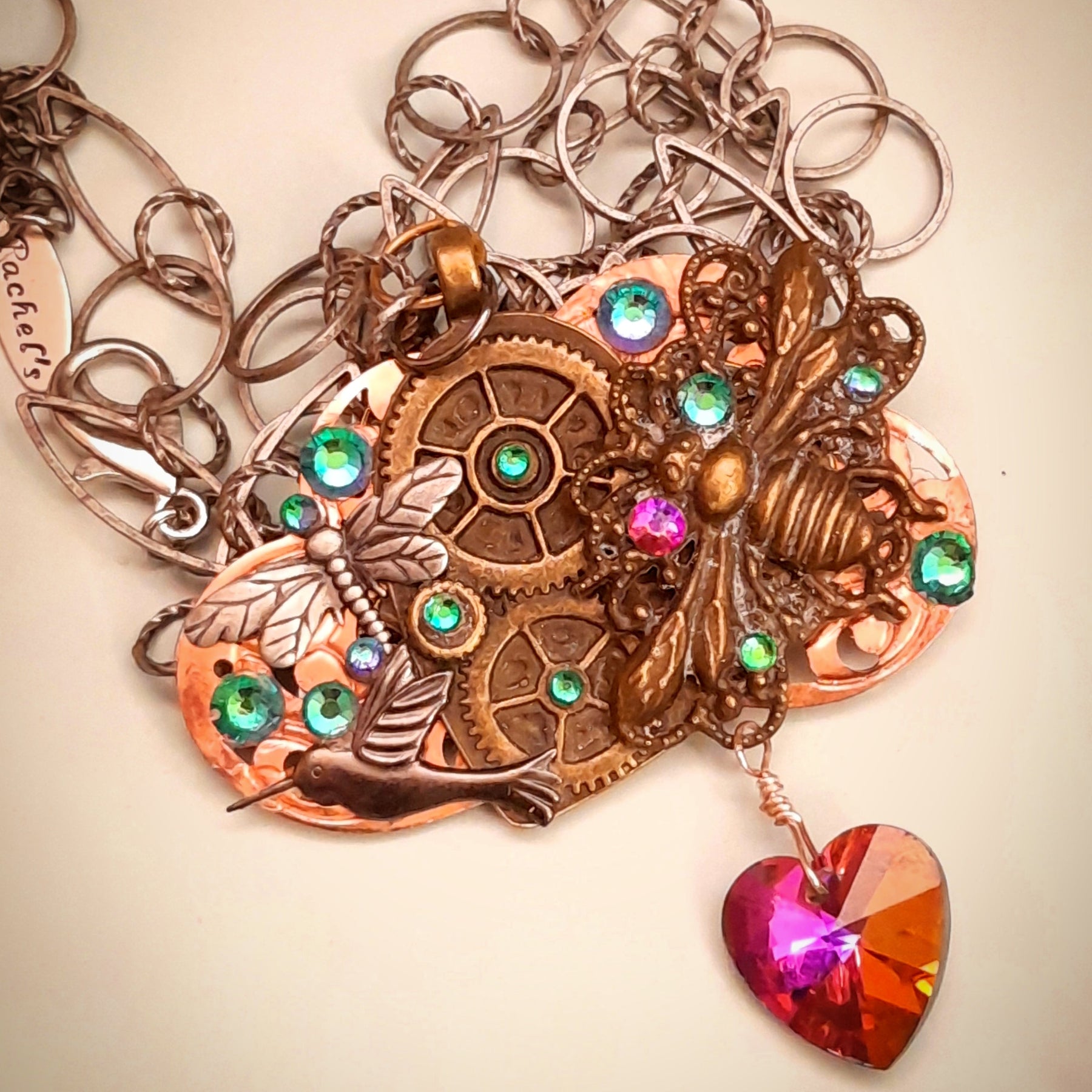 
Magical steampunk bee necklace with multicolored Vitrail Medium crystal heart, dragonfly, hummingbird, and world-renowned genuine Swarovski crystals

