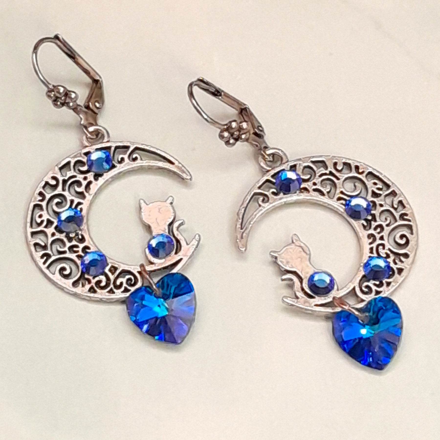 Handmade Victorian style vintage style celestial sapphire blue Swarovski crystal earrings with cat moon design

