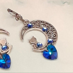 Handmade Victorian style vintage style sapphire blue Swarovski crystal earrings with filigree moon and cat charm