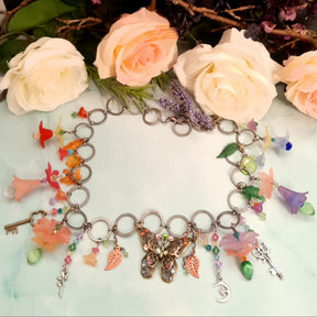 Handmade magical fantasy butterfly boho necklace with rainbow Swarovski crystals and nature charms, Victorian style vintage style antique silver chain

