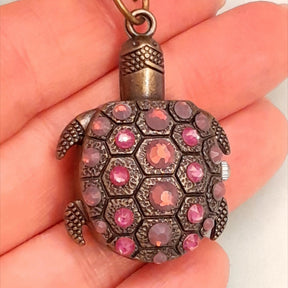Turtle purse charm working watch with purple Swarovski crystals held in hand showing shell detail, Victorian style vintage style handmade slave bracelet Rachel Flam Design