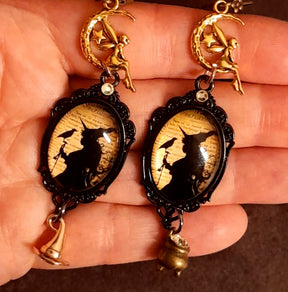 Detailed Halloween fantasy earrings with witch and raven scenes, celestial fairies, crescent moons, aged script imagery, and Swarovski crystal sparkle, Victorian style vintage style magical jewelry
