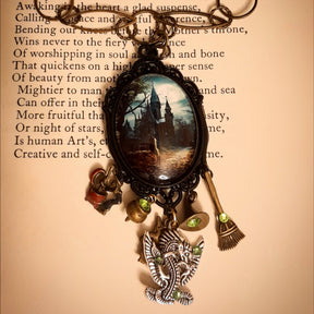 Victorian style vintage style witchy fantasy necklace with detailed castle scene, mystical charms, dragon pendant, and sparkling Swarovski crystals, Rachel Flam Design