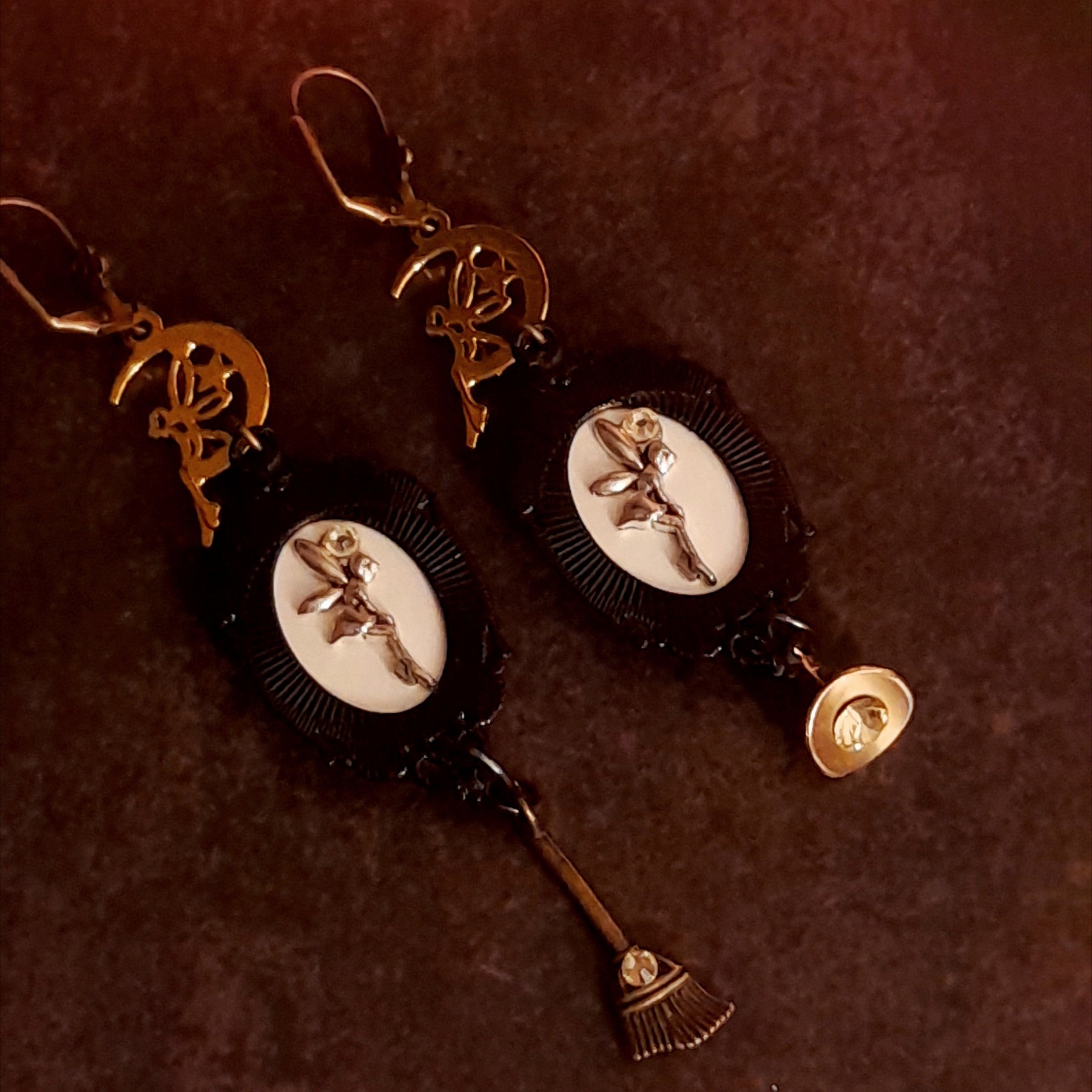Handmade crow and raven earrings with moon charms, witch hat, broom, yellow crystals, and hidden fairy details, Victorian style and vintage style magical fantasy jewelry by Rachel Flam Design