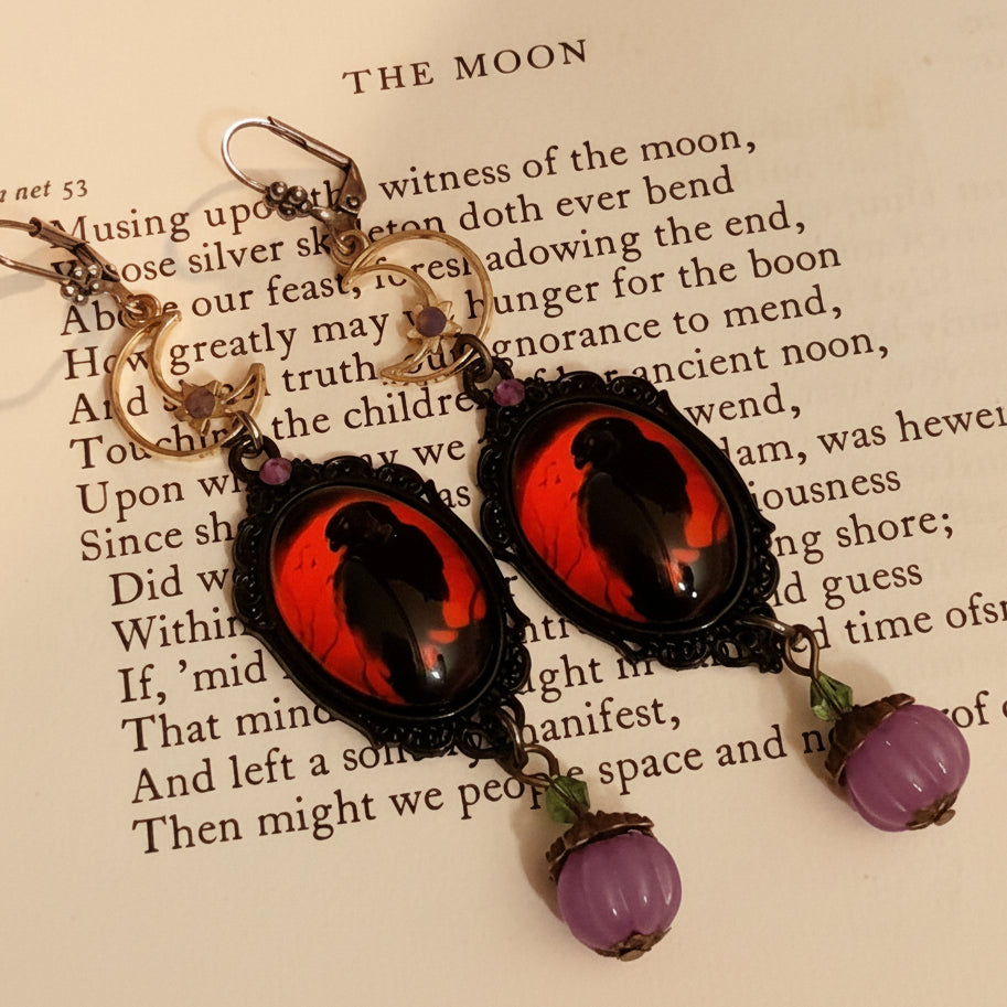 Witchy dangle earrings with black crows, crescent moons, purple pumpkin drops, green crystal accents, and fairies hidden on the reverse, Victorian style and vintage style fantasy jewelry by Rachel Flam Design