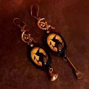 Handmade witchy crow and fairy earrings with celestial moon charms, yellow Swarovski crystals, raven imagery, Victorian style and vintage style magical fantasy jewelry by Rachel Flam Design