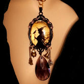 Handmade witchy crow necklace with a framed witch and raven scene, lavender purple Swarovski crystals, and magical talisman details, Victorian style and vintage style fantasy jewelry by Rachel Flam Design