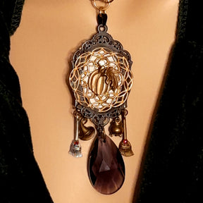 Double-sided handmade witchy necklace with an ornate pumpkin reverse, witch and raven pendant, purple Swarovski crystals, Victorian style and vintage style magical fantasy jewelry by Rachel Flam Design