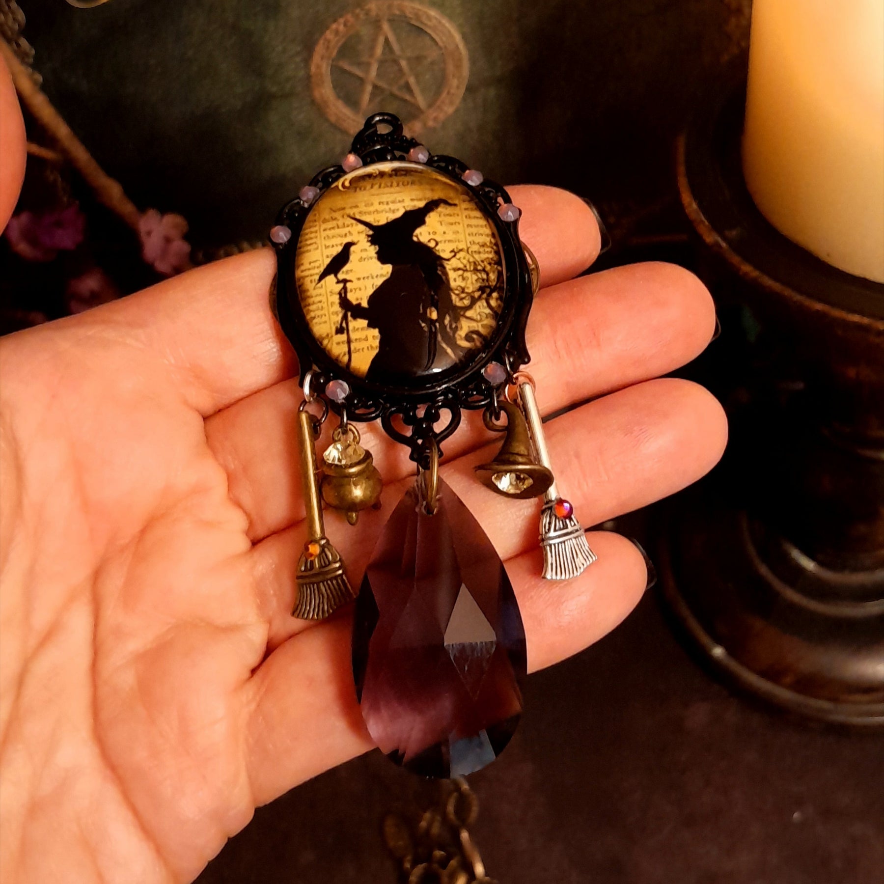 One-of-a-kind witchy crow necklace with raven details, framed cabochon, purple Swarovski crystals, witch hat, and cauldron charms, Victorian style and vintage style fantasy jewelry by Rachel Flam Design