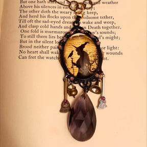 Witchy necklace featuring ravens, a witch hat, cauldron, broom charms, and sparkling Swarovski crystals in purple tones, Victorian style and vintage style magical fantasy jewelry by Rachel Flam Design