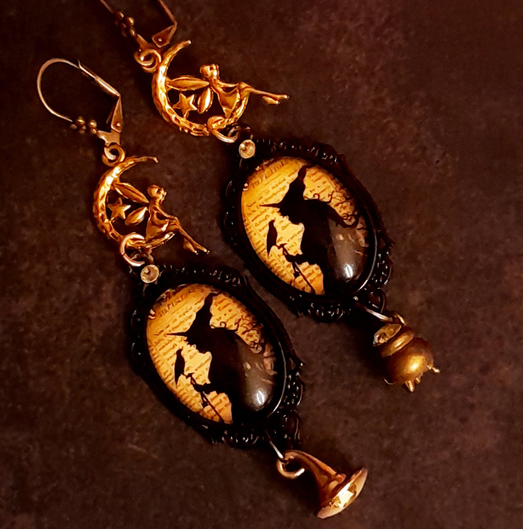 Handmade Halloween witchy fairy earrings with crescent moons, ravens, witch imagery, a cauldron, a witch hat, and sparkling Swarovski crystals, Victorian style vintage style magical fantasy jewelry