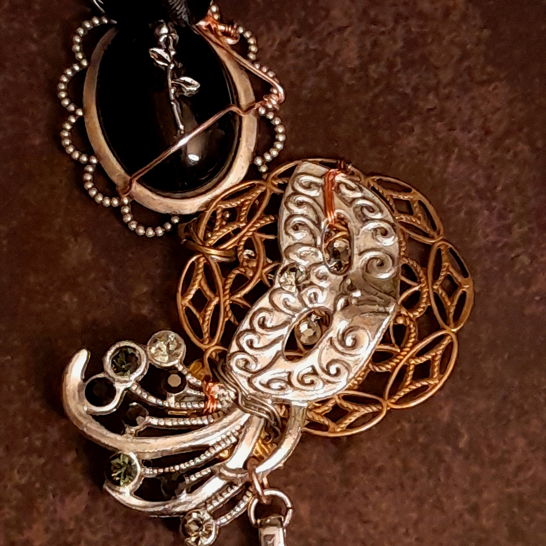 Detail of jet black and grayish silver crystals on witchy masquerade Halloween necklace, Victorian style vintage style sparkle jewelry
